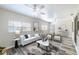 Inviting living room boasts neutral tones, luxury vinyl plank flooring, and plenty of natural light at 1713 W Louisiana Ave, Tampa, FL 33603