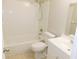 Bright, clean bathroom with white fixtures, tiled shower, and a vanity sink at 17236 Spring Valley Rd, Dade City, FL 33523