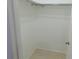 Walk-in closet with tile flooring and a metal clothing rod at 17236 Spring Valley Rd, Dade City, FL 33523