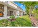 Backyard view showing a patio area, green lawn, and partial fencing of the property at 1749 Sedgefield Ct, Odessa, FL 33556