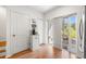 Kitchen adjacent to a doorway to the exterior, includes coffee machine at 1749 Sedgefield Ct, Odessa, FL 33556