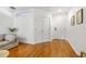 Bright living room with hardwood floors and white walls, offering a clean and modern look at 1749 Sedgefield Ct, Odessa, FL 33556