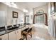 Elegant primary bathroom with dual sinks, large vanity, and luxurious soaking tub at 1802 Oak Ridge Rd, Safety Harbor, FL 34695