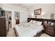 Bedroom featuring a decorative duvet cover, wooden furniture and neutral carpet at 1802 Oak Ridge Rd, Safety Harbor, FL 34695