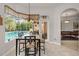 Sun-lit breakfast nook with views of the pool and outdoor space, perfect for casual dining at 1802 Oak Ridge Rd, Safety Harbor, FL 34695