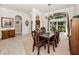 Formal dining room featuring a large window for natural light and a classic dark wood dining set at 1802 Oak Ridge Rd, Safety Harbor, FL 34695