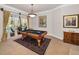 Bright game room featuring a pool table, natural light, and access to the outdoor pool at 1802 Oak Ridge Rd, Safety Harbor, FL 34695