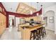 Spacious kitchen with granite countertops, stainless steel appliances, and a breakfast bar at 1802 Oak Ridge Rd, Safety Harbor, FL 34695