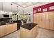 Stylish kitchen with granite counters, an island, and ample cabinetry in an open layout at 1802 Oak Ridge Rd, Safety Harbor, FL 34695