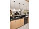 Open kitchen with a modern sink, black dishwasher, and pendant lighting fixtures at 1802 Oak Ridge Rd, Safety Harbor, FL 34695
