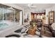 Comfortable living room with view of pool and lanai, seamlessly connected to the kitchen at 1802 Oak Ridge Rd, Safety Harbor, FL 34695
