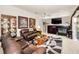 Inviting living room with a fireplace, entertainment center, and comfortable seating area at 1802 Oak Ridge Rd, Safety Harbor, FL 34695