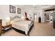 Relaxing bedroom with warm colors, soft carpet and access to en-suite bathroom and walk-in closet at 1802 Oak Ridge Rd, Safety Harbor, FL 34695