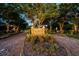 Neighborhood entrance with brick sign and landscaping at 1802 Oak Ridge Rd, Safety Harbor, FL 34695