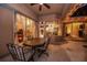 Enclosed patio featuring a ceiling fan and glass windows overlooking the interior of the home at 1802 Oak Ridge Rd, Safety Harbor, FL 34695