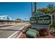 A welcoming sign to Downtown Safety Harbor, amidst lush landscaping along a quaint street at 1802 Oak Ridge Rd, Safety Harbor, FL 34695