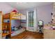 A cozy bedroom with playful bunk beds and decor is featured, creating a fun and inviting space for  at 18816 Tracer Dr, Lutz, FL 33549