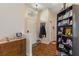 Warm and welcoming foyer with hardwood floors, arched transom window and built-in bookshelf at 18816 Tracer Dr, Lutz, FL 33549