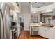 Bright kitchen featuring stainless appliances, tile backsplash and stylish countertops at 18816 Tracer Dr, Lutz, FL 33549