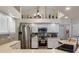Modern kitchen featuring stainless steel appliances, white cabinets and complementary countertop at 18816 Tracer Dr, Lutz, FL 33549