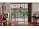 Living area featuring a sliding glass doors leading to an enclosed Florida room at 18816 Tracer Dr, Lutz, FL 33549