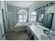 Bright bathroom features a garden tub, separate shower, and dual sinks with plenty of counter space at 19709 Wyndham Lakes Dr, Odessa, FL 33556