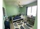 bedroom featuring a green accent wall, and sports themed decor at 19709 Wyndham Lakes Dr, Odessa, FL 33556