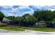 Exterior shot of the Wyndham Lakes community sign with landscaping at 19709 Wyndham Lakes Dr, Odessa, FL 33556
