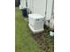 Exterior view of a Generac generator with AC and propane tank on a grassy area at 19709 Wyndham Lakes Dr, Odessa, FL 33556