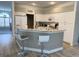 Eat-in kitchen with white cabinetry, granite countertops, and breakfast bar with seating at 19709 Wyndham Lakes Dr, Odessa, FL 33556
