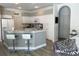 This kitchen features granite countertops, stainless steel appliances, and white cabinets at 19709 Wyndham Lakes Dr, Odessa, FL 33556