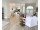 Open-concept home showcasing the living room, dining area, and kitchen with modern finishes at 19709 Wyndham Lakes Dr, Odessa, FL 33556