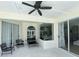 Covered patio features ample seating area with screened-in design and windows at 19709 Wyndham Lakes Dr, Odessa, FL 33556