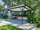 Exterior view of the community picnic shelter with surrounding landscaping at 19709 Wyndham Lakes Dr, Odessa, FL 33556