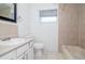 Bathroom featuring a vanity, toilet, and shower/tub combination with tile surround at 2004 Windsor Way, Tampa, FL 33619