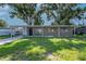 Cozy single-story home featuring a covered carport and quaint front yard at 2004 Windsor Way, Tampa, FL 33619