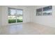 Open living space featuring tiled floors and bright, natural light at 2004 Windsor Way, Tampa, FL 33619