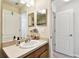 A bathroom featuring an oval sink, vanity, and multiple mirrors at 2347 Willimette Dr, Wesley Chapel, FL 33543