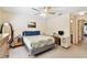 Bedroom with a ceiling fan, closet, desk, and natural light at 2347 Willimette Dr, Wesley Chapel, FL 33543