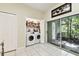 Convenient laundry room with washer, dryer, and access to outdoor patio at 2347 Willimette Dr, Wesley Chapel, FL 33543
