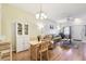 Open-concept living and dining area with hardwood floors and large windows with lots of light at 2347 Willimette Dr, Wesley Chapel, FL 33543