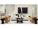 Modern living room featuring neutral tones, stylish furniture, and contemporary art at 2671 Buttercup Lucine Ln, Ruskin, FL 33570
