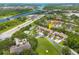 Beautiful aerial view of a waterfront community with an arrow pointing to an available unit in the neighborhood at 3044 Red Oak Ct # 204, Palm Harbor, FL 34684