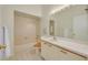 Bright bathroom with a tub, neutral tiling, and single sink at 3044 Red Oak Ct # 204, Palm Harbor, FL 34684