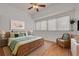 Nicely decorated bedroom with hardwood floors, lots of natural light, and a calming color scheme at 3044 Red Oak Ct # 204, Palm Harbor, FL 34684