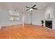 Expansive living room featuring wood floors, ample natural light, and an open layout at 3044 Red Oak Ct # 204, Palm Harbor, FL 34684
