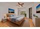 This main bedroom features a beautiful view from the windows, a ceiling fan, and tasteful decorations at 3044 Red Oak Ct # 204, Palm Harbor, FL 34684