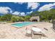 Enjoy this beautiful community pool with lounge area and adjacent cabana, perfect for relaxing and soaking up the sun at 3044 Red Oak Ct # 204, Palm Harbor, FL 34684