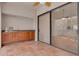 The screened porch with cabinets creates a nice area for relaxing and enjoying the scenery from inside the house at 3044 Red Oak Ct # 204, Palm Harbor, FL 34684