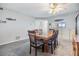 Bright dining room featuring neutral wall paint and carpet, and light fixture at 3055 Casa Del Sol Cir # 202, Clearwater, FL 33761